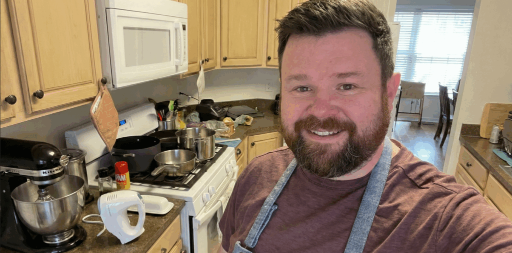 Travis Landers cooking in a kitchen