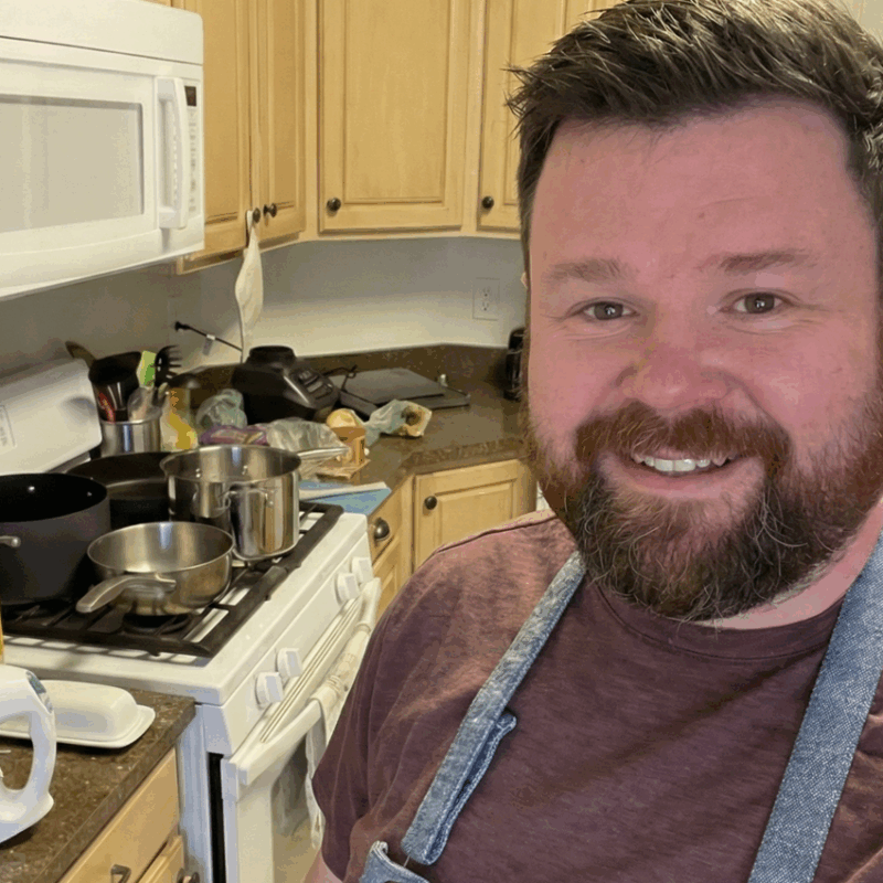 Travis Landers cooking in a kitchen